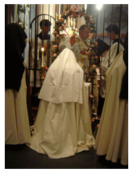 The Priest blessed the new Novice The Priest blessed the new Novice