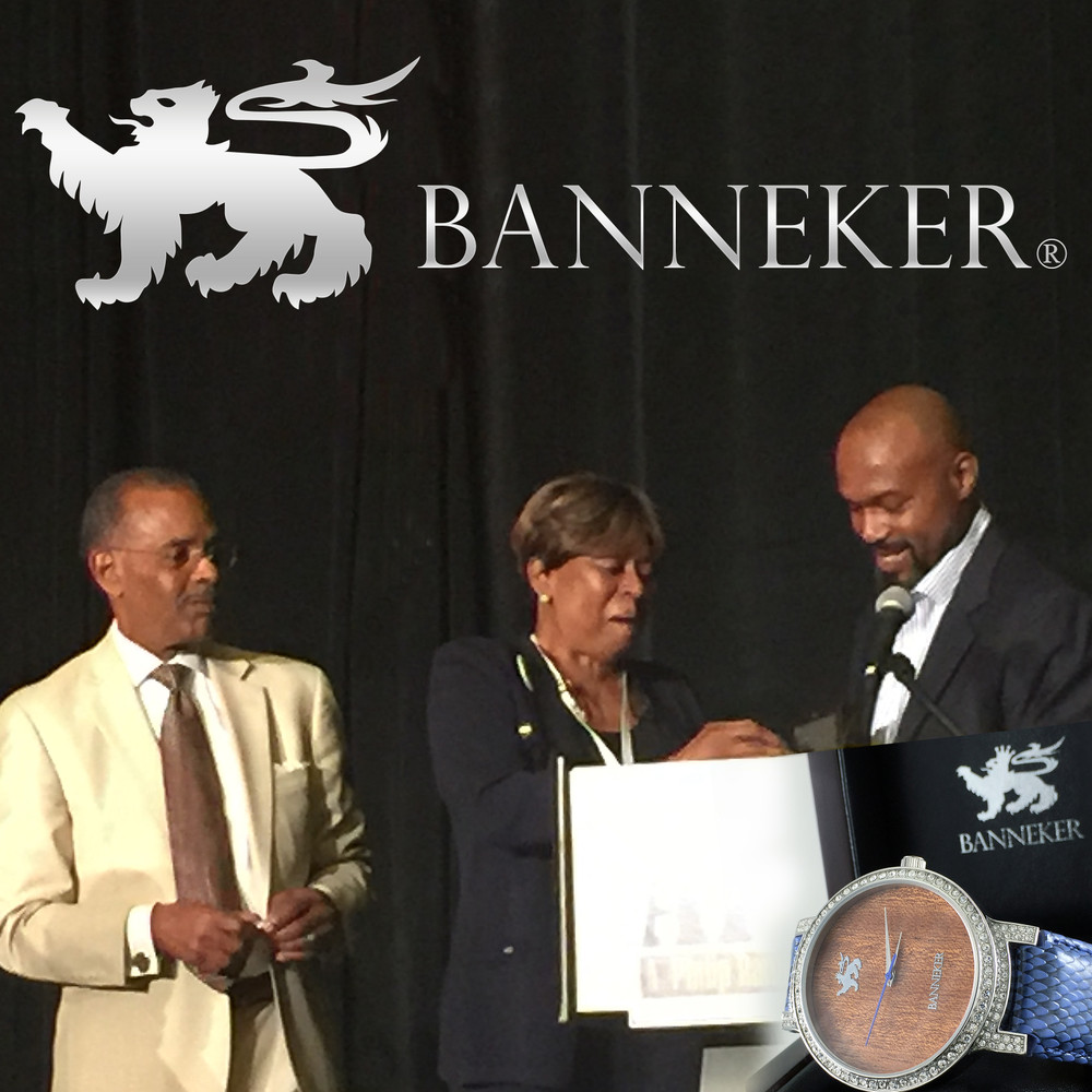 Tim Hardaway presents watch during event moderated by The Black Eagle - Joe Madison.