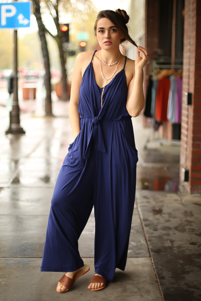 Ride the Waves Navy Draped Jumpsuit with Pockets front view.
