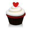 Traditional southern-style red velvet cake and cream cheese icing topped with a little red fondant heart