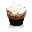 Moist spice cake infused with pineapples, bananas and pecans topped with cream cheese frosting and pecans
