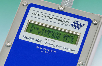 Close-up of the Model 404 Intrinsically Safe Vibrating Wire Readout LCD display.