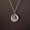Stunning fashionable working mini earth compass really works.  Hangs elegantly on a sterling silver chain.