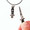 YOU gNeek's YOU Are Sooo Dangerous Switchblade Necklace shown here in the flicked open position and closed (on your necklace) position.