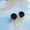 Beautiful liquid-filled compasses are turned into tiny stud earrings.