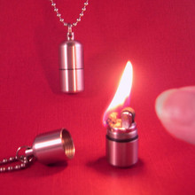 Teeny lighter necklace can be used as a quick candle.