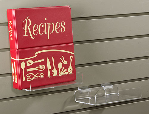 Clear acrylic slatwall display shelf.