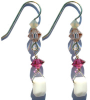 Very rare Swarovski elements, emerald shaped chalk white crystal from the 1930's hangs from sterling silver earring, accented by fuchsia,sand and champagne colored crystals