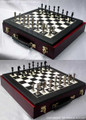 Staunton chess set after being cast and one side polished and the other painted black. Board sold separately. Display case unavailable.