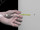 Drill a 1/2" (Ø13mm) hole. Hold metal channel flat alongside plastic straps and slide channel through hole. Minimum clearance behind wall: 1-7/8" (48mm).