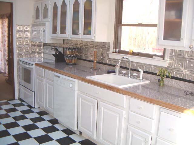 Creatice White Kitchen Cabinets With Metal Backsplash with Simple Decor
