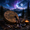 Shamanic drum and ritual objects under a moonlit sky representing Shaman Isochiral Music and shamanic journey meditation