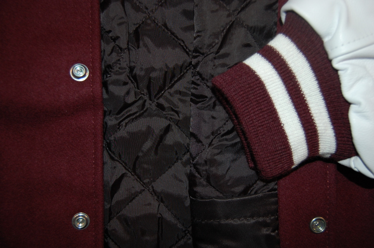 maroon and white varsity jacket