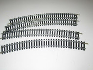 HO - FOUR SECTIONS OF 18" CURVE STEEL TRACK - EXC. - H21