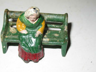VINTAGE DIECAST FIGURE - WOMAN SITTING ON A BENCH - 2" TALL - FAIR- M41