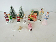 LEMAX CAROLER PORCELAIN FIGURINES & EXTRAS WITH 4 SNOW COVERED PINES ASST H5