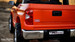 Tailgate orange Tundra rear driver side view