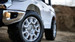 White Tundra rubber tires driver side