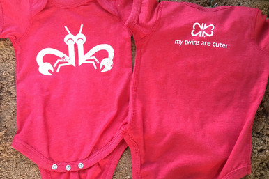 Our twin "Clever Crab" bodysuit set has a distressed white ink on a vintage red tee with logo on the back. twin baby bodysuit set.