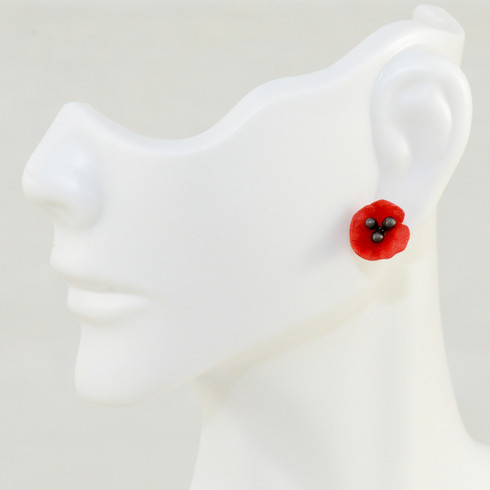Red Poppy earrings. Hand patinated bronze with red cast glass petals. 0.5" diameter. 