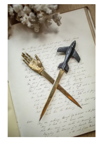 letter-opener-hand-and-airplane.png