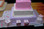 Approximate Servings 150. Sizes: 3/4 Sheet, 1/2 Sheet squared and 1/4 Sheet squared. Three tiered baby block baby shower cake which will be sure to delight all your guests.