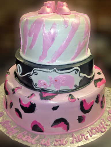 Approximate Servings 80. Sizes: 7", 10" & 14". For the artistic among the group, a three tiered cake with modern inturpretation animal print and baby booties on top.