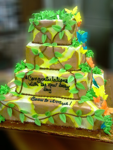 Approximate Servings 145. Sizes: 1/8 sheet sq, 1/4 sheet sq, 1/2 sheet sq & 3/4 sheet sq. This jungle themed baby shower cake has cascading sugar butterflies to lighten it up a bit with some color and detail.