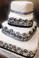 4 tier spiraling squared cake

serves approximately 150 People

The sizes approximately 17"x17", 12"x12", 8"x8" & 5"x5"

Satin Ribbon, Swirls piped with cream