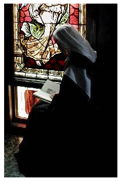 A sister reading in the choir spiritual ready, sister, nun