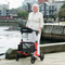 Escape Rollator Charcoal -19", 21" and 24" seat height with lady at harbor