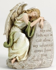 Angel statue leaning against a rock with the words “My soul finds rest in God alone. My salvation comes from Him” inscribed. 