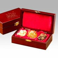 Gifts of the Three Kings Boxed Set, Gold Frankincense and Myrrh. The Original Gifts of Christmas ~ Gold Frankincense & Myrrh
A silhouette of the Magi following the Christmas star - printed in gold - tops the lid of a richly detailed box.
The cherry stained finish of a solid wood chest is offset by the unique brass latch. The box makes a beautiful, meaningful and dramatic presentation.

The interior of the box is striking with its luxurious red satin lining on both the padded lid and base. The large tears of frankincense, hand-blown glass ball with 23kt gold inside and crystals of Arabian myrrh are nestled together in this beautiful collection of the Gifts of the Three Kings.
- Authentic 23 K Gold in Hand Blown Glass Orb 
- Authentic Frankincense & Myrrh, too 
- Satin Lined Hand-Crafted Wood Display Case 
- Wonderfully Gift-Boxed 
- Certificates of Authenticity and History & Care Instructions included.
6.75 x 3.75 x 2.00.