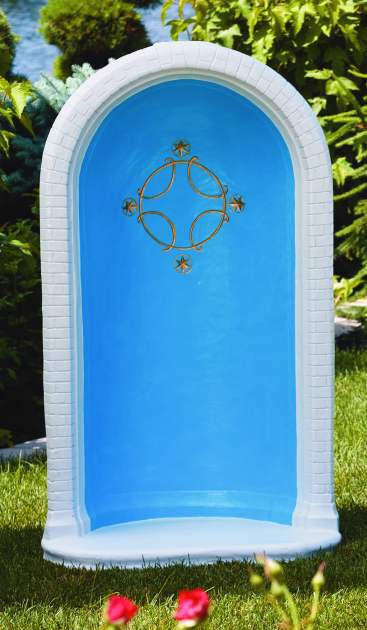 Rounded grotto with cross and stars in blue, white, and gold.