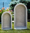 Two sizes of the round dot embossed grotto in natural finish standing outside.