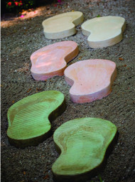 Three pairs of stepping stones in the shape of flip flops in three different colors. 
