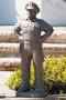 Law enforcement officer garden statue standing on a porch