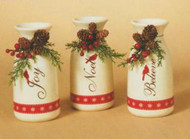 Three 6" ceramic holiday milk bottles with floral accents and holiday sentiment written on side: Joy, Noel and Believe. Comes boxed.