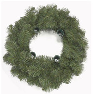 Aerial view of pine wreath with four candle holders along the center rim.