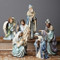 Nativity set with Holy family and the three kings in blue robes. 