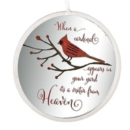 Round, silver, ornament with a glittery red cardinal