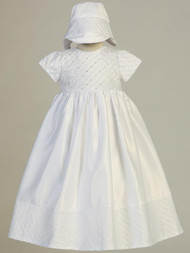 Embroidered white satin gown with sequins and beads. Comes with matching bonnet. Made in USA.
