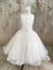 This dress is made with high-quality materials, including organza, French net, and bridal satin.
The dress is embellished with embroidery, pearls, sequins, and crystals.  If you are looking for a simple, yet stunning First Holy Communion dress for your daughter, this is a great option. The simple style paired with the beautiful detailing creates a dress that your little one will absolutely love. Start shopping for your daughter or granddaughter’s communion dress now!
Details:
Diamond White Organza, French net, and satin
Pearl and crystal detailing
Buttons in back
Multiple sizes
Please call us at 1.800.523.7604 for verification of items in stock as they are selling quickly!
Items are non returnable
