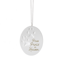 White oval ornament with the imprint of paw prints