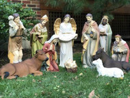 Large Nativity set displayed in grass.