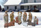 Large Nativity set displayed in snow. 