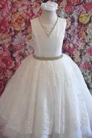 From the Couture Collection comes this Lace & silk communion dress and features crystals belt & trim.