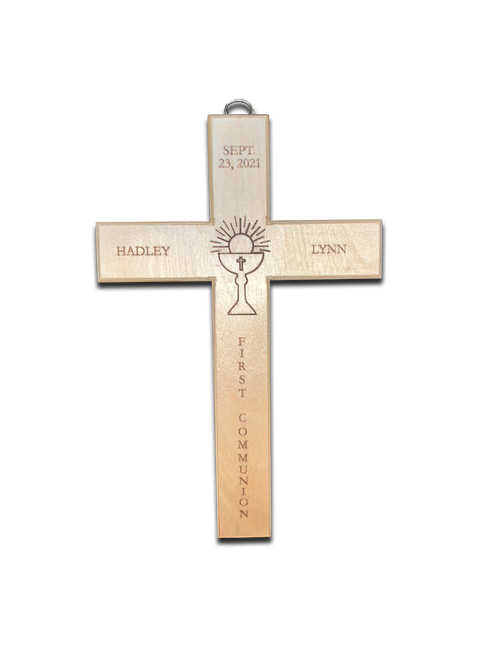 Personalized 10 1/2" x & 6"W Wall Cross. Cross is personalized with child's first and middle names, and First Communion date. A Chalice and Host symbol is in engraved in the middle of the cross. Underneath the host and chalice symbol the cross is inscribed with "First Communion".  A hook is attached at the top of the cross for easy hanging. These are special order, please allow 4 weeks for delivery. Personalized items are not returnable