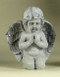 Angel figure kneeling and praying. 