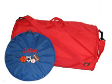 Royal Blue Roll Bag with Cooper Letter Style Monogram and Sports Ball Design. (Shown collapsed for easy storage.)

Red Roll Bag (Shown expanded with shoulder strap.)